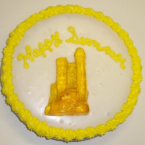 Cookie Cake Pie With Almond Cookie and Lemon Cake 9-topped With Tropical Punch Sand Castle Gummie logo
