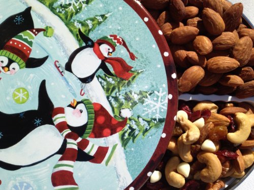 Farewell To Winter With Fresh Roasted Almonds & Cranberry Truffle Mix — A Skating Penguin Appreciation Gift Tin By Nut Roaster’s Reserve (featuring White Chocolate, Cashews and Cranberries) logo