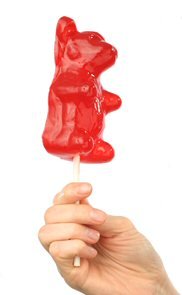 Giant Gummy Bear On A Stick – Cherry Cola logo