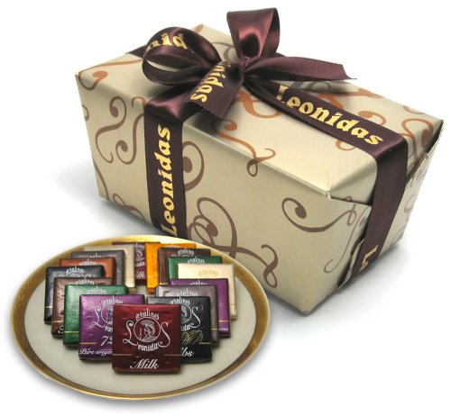 Leonidas Belgian Chocolates: 1 Lb Napolitain Sampler Ballotin – Orange, Nibs, Feuilletine, 72% Pure Origin Sao Tome, Milk, White, and Dark Chocolate Squares logo