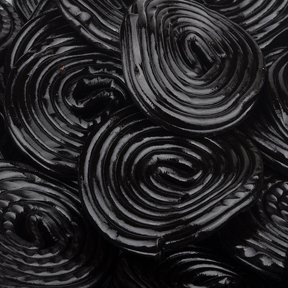 Marini’s Candies Black Licorice Wheels logo