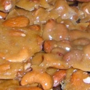 Mixed Nut Brittle In A One Pound Gift Box logo
