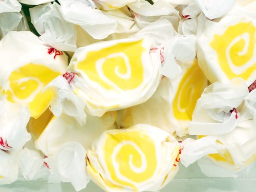 Pina Colada Yellow & White Gourmet Salt Water Taffy 1 Pound Bag logo