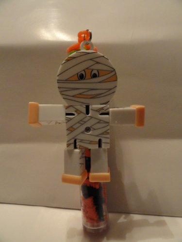 Poseable Mummy Keychain Attached To Tube Of Hard Candy logo