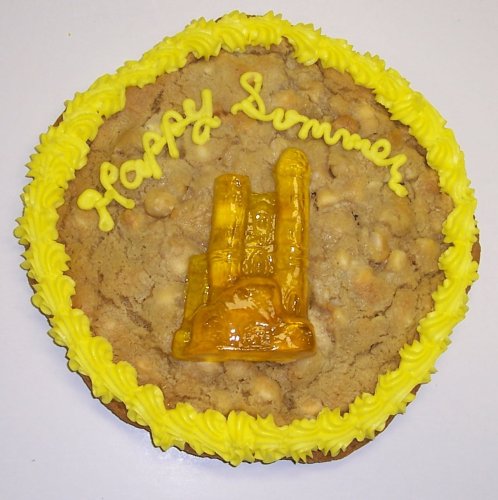 Scott’s Cakes 2 Lb. Chocolate Chip Cookie Cake With Tropcal Punch Sand Castle Gummie logo