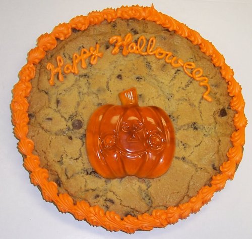 Scott’s Cakes 2 Lb. M & M Cookie Cake With Gummie Pumpkin Orange Trim logo