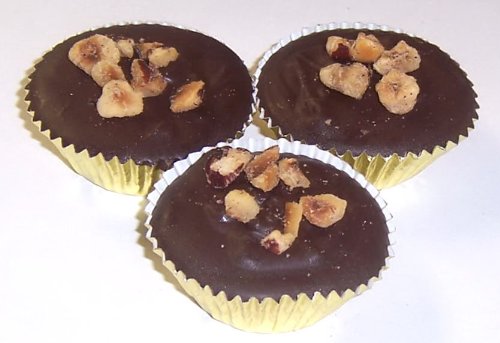 Scott’s Cakes Dark Chocolate Hazelnut Clusters In A Decorative Box logo