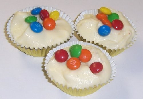 Scott’s Cakes White Chocolate M & M Clusters In A Decorative Box logo