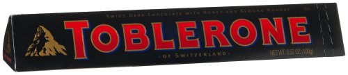 Toblerone Swiss Dark Chocolate With Honey and Almond Nougat, 3.52 ounce Bar (Pack of 12) logo