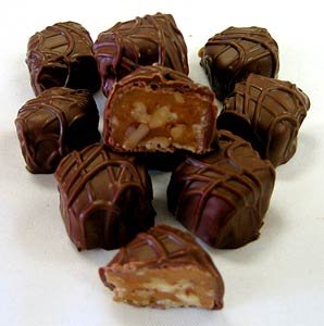 Wockenfuss Candies King Tut (chopped Pecans and Caramel), Milk Chocolate logo